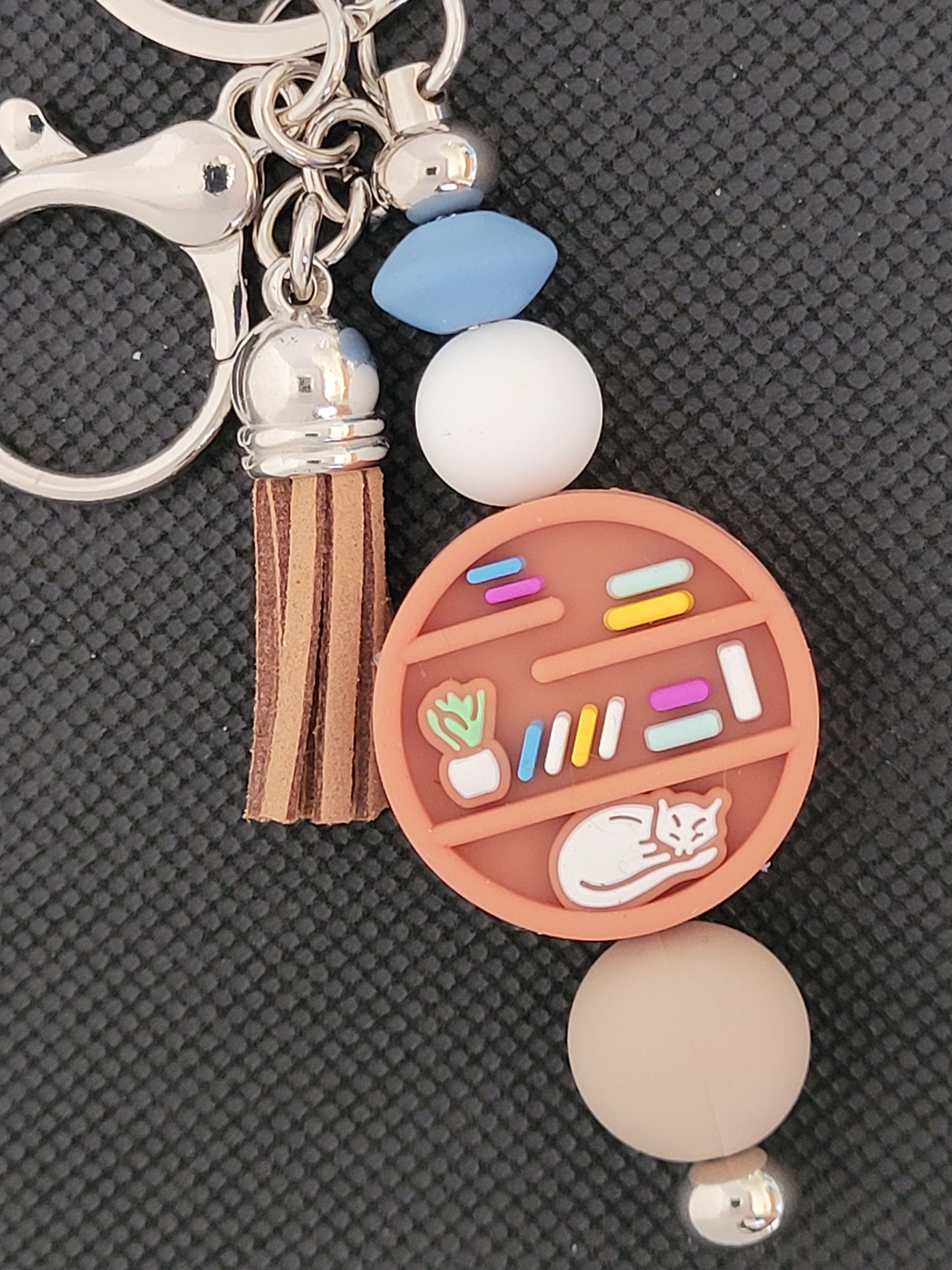 Bookshelf with cat beaded keychain