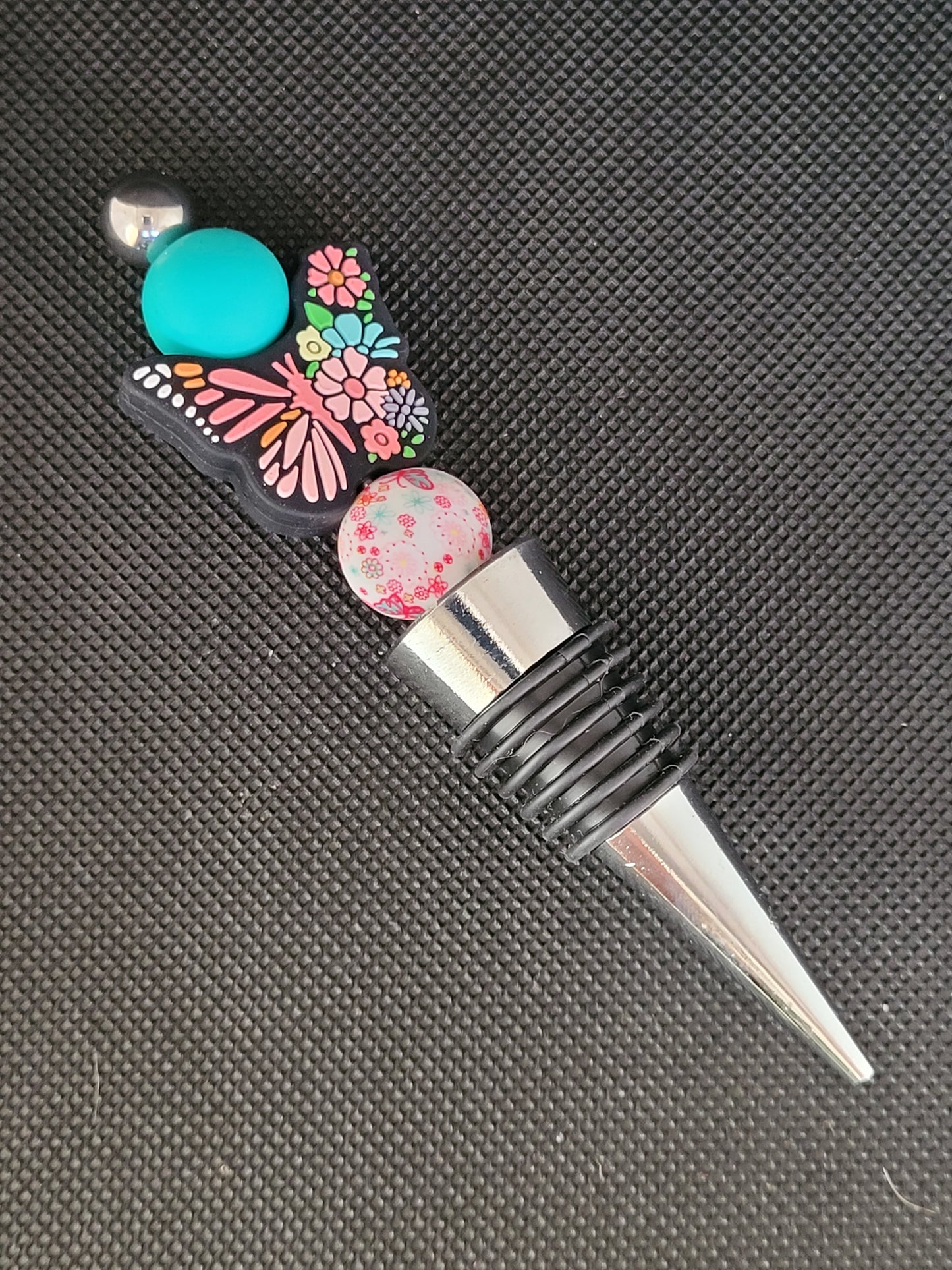 Butterfly (with flowers abd a teal bead) beaded wine stopper