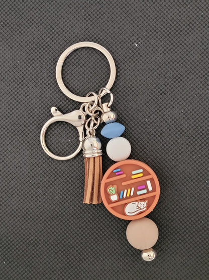 Bookshelf with cat beaded keychain